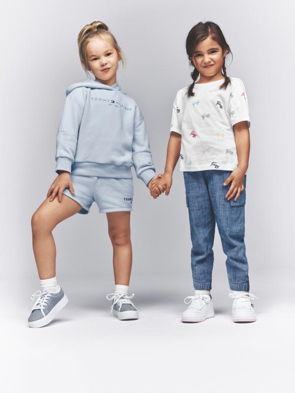 Two kids wear new spring apparel from Tommy Hilfiger.