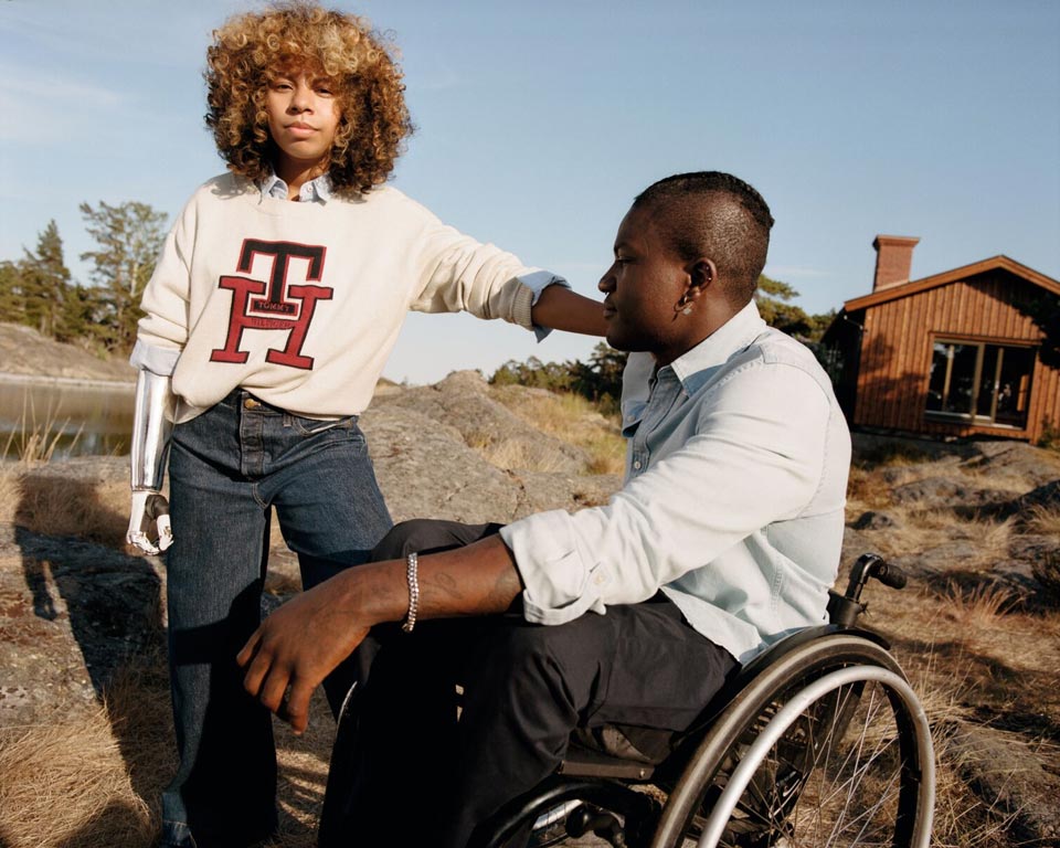 A male and female model each wear new season apparel from Tommy Hilfiger Adaptive, designed for ease of dressing.