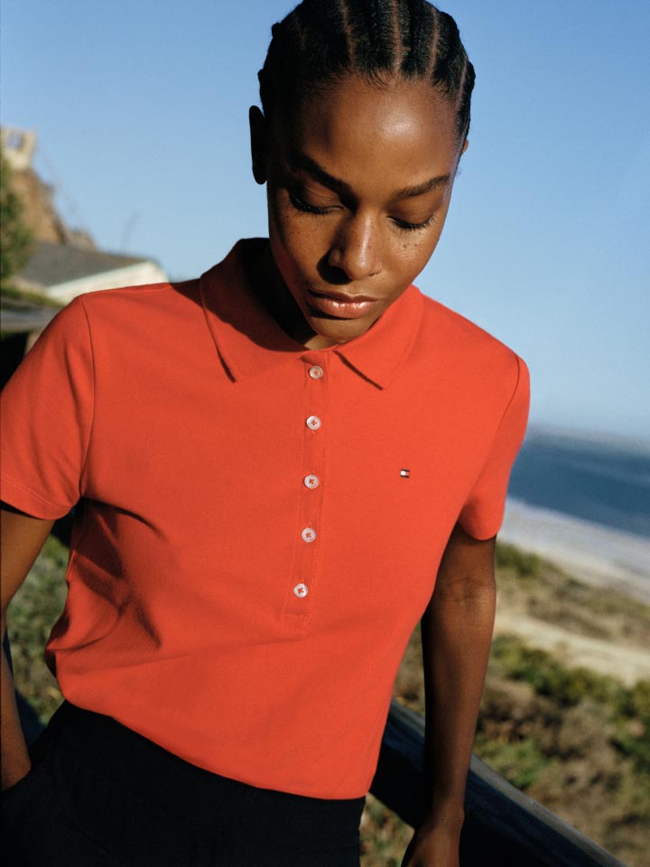A female model wears a polo, new from Tommy Hilfiger.