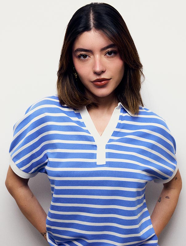 Sabrina Quesada wears a denim jacket and striped polo, new from Tommy Hilfiger.