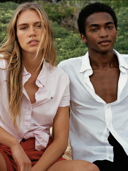 A male and female model wear Tommy Hilfiger oxfords, new for summer.