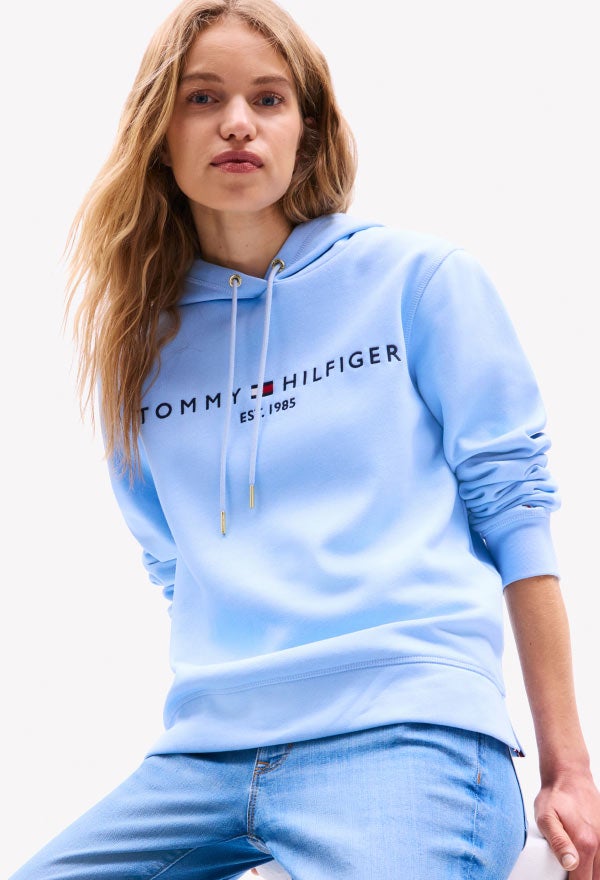 Woman Wearing Tommy Hilfiger Logo Hoodie