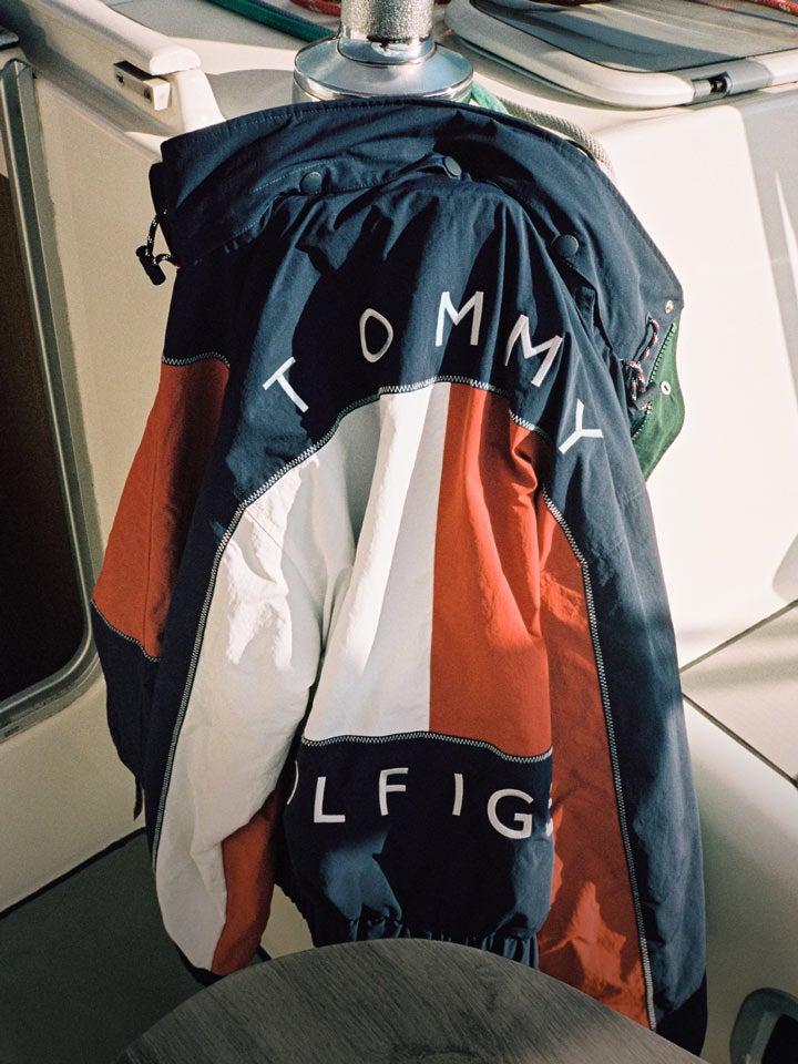 Tommy Hilfiger sailing jacket hanging on the corner of a boat