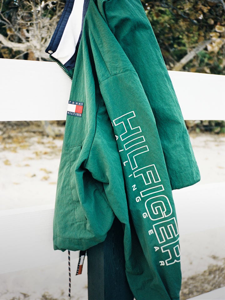 Tommy Hilfiger sailing jacket hanging on a fence