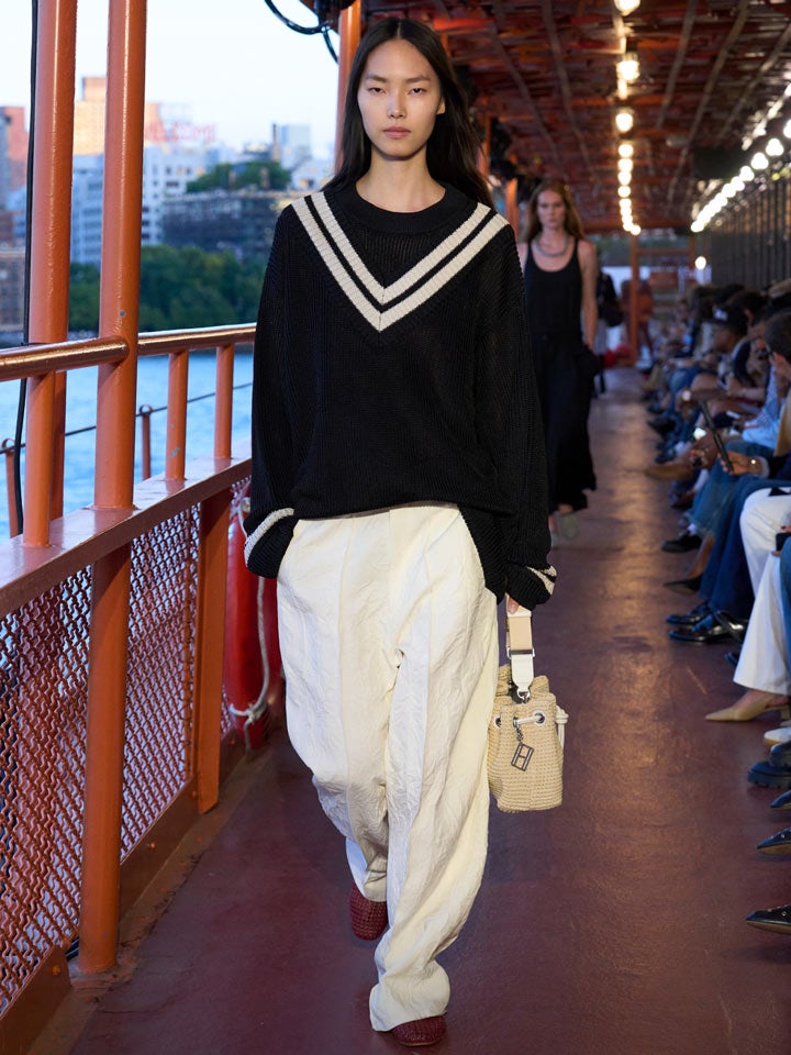 Shop the Look: Oversized Varsity Sweater, Tailored Drapey Pant, Crochet Mules and Crochet Drawstring Shoulder Bag