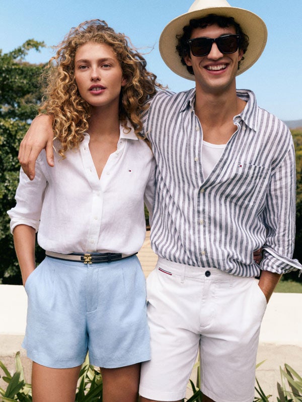 Man with his arm around a woman both dressed in Tommy Hilfiger linen essentials