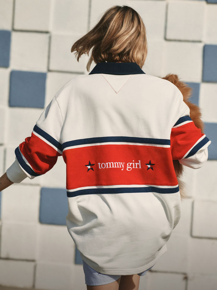 Woman turned around wearing Tommy Girl By Tommy Hilfiger rugby polo