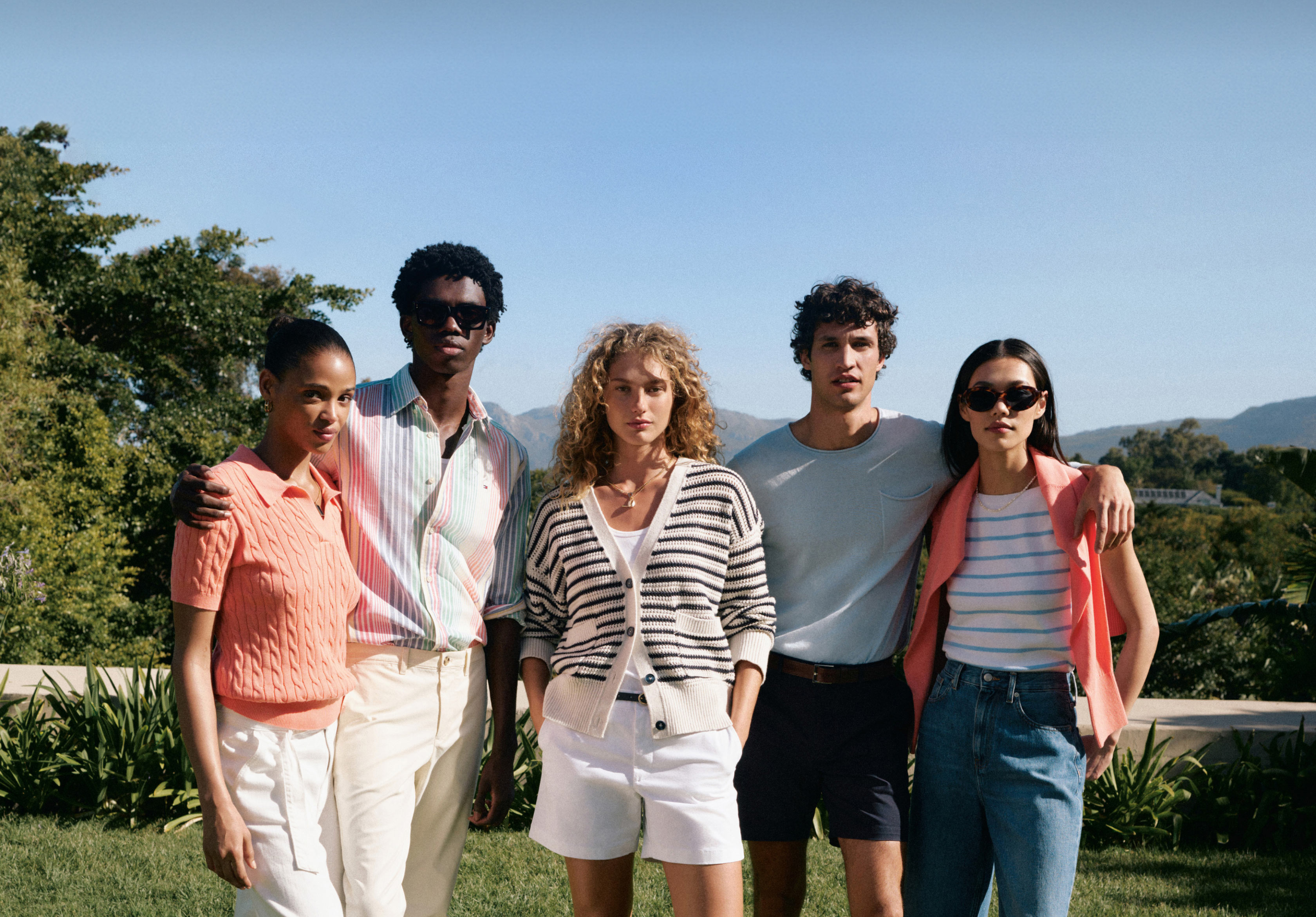 Girls walking down the street in 90's inspired Tommy Girl by Tommy Hilfiger outfits.