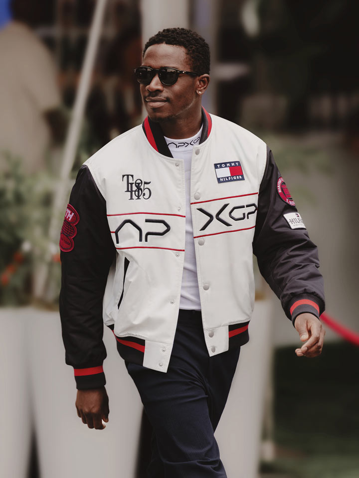 Damson Idris wearing white APXGP motor jacket