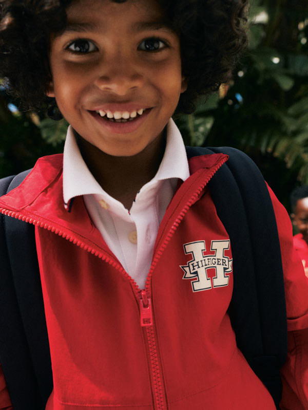 Kid with backpack on wearing Tommy Hilfiger zip up
