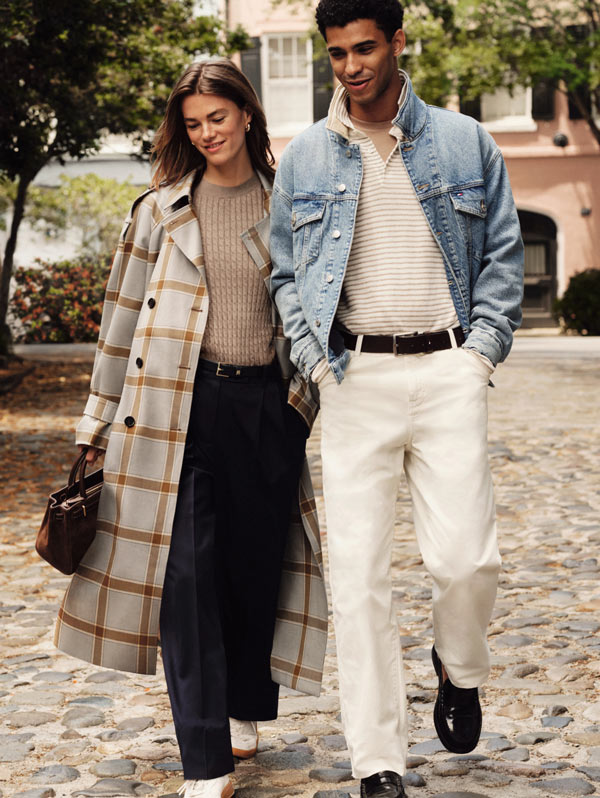 A women and a men walking in the street wearing Tommy Hilfiger