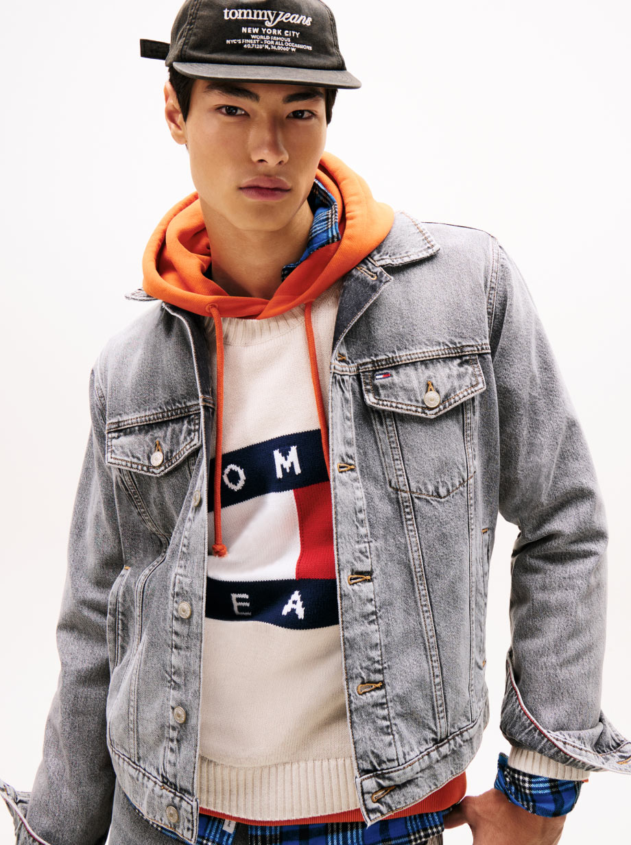 A man standing wearing Tommy Jeans
