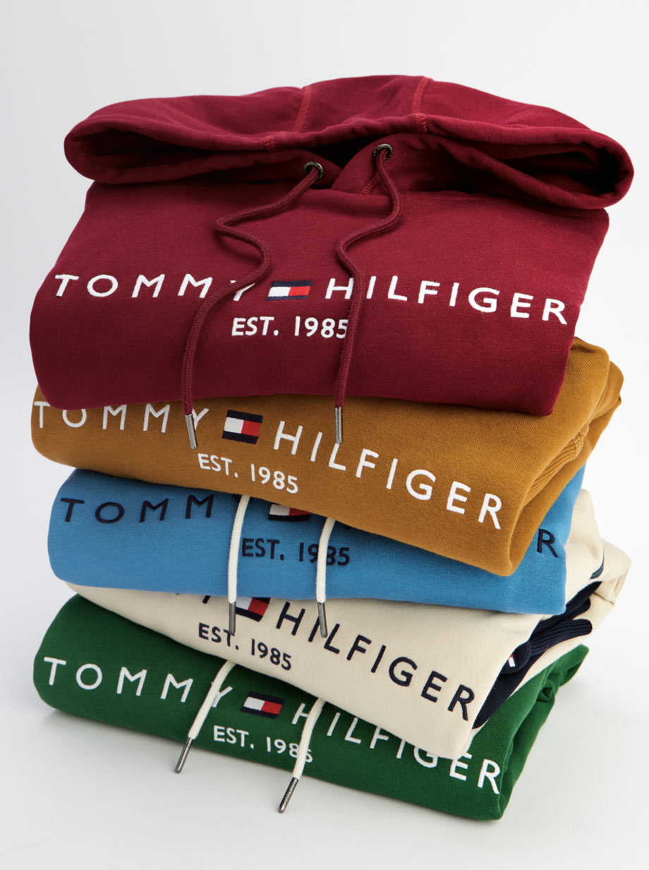 A stack of Tommy logo sweatshirts