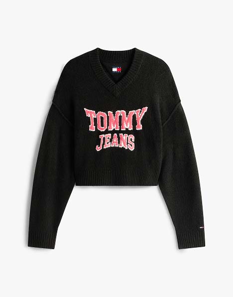 Black Tommy Jeans sweatshirt with bold pink and white logo graphic on the chest.