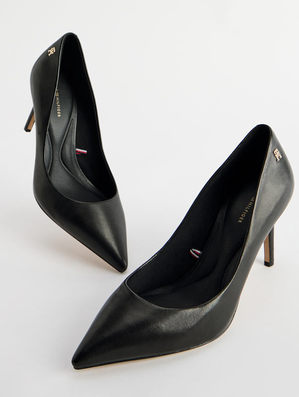 Pair of black pointed-toe Tommy Hilfiger high heels with subtle textured finish.