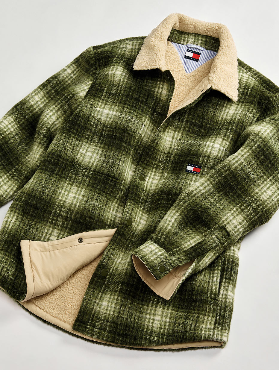 Green plaid Tommy Jeans overshirt with a contrast tan collar and chest logo detail, laid flat on white.