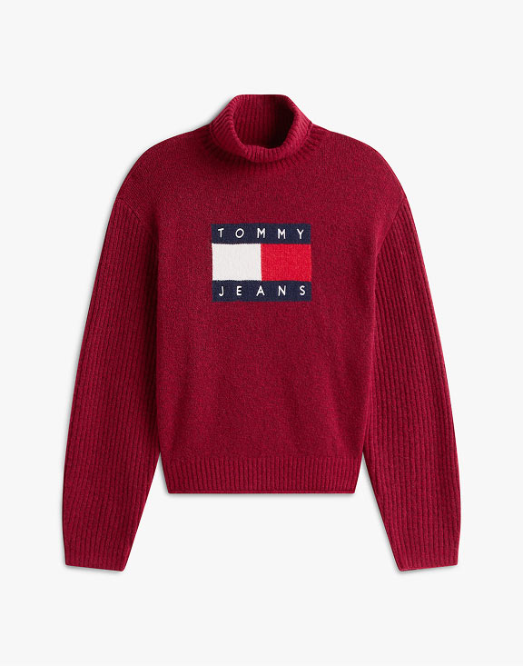 Burgundy Tommy Jeans turtleneck sweater with a centered flag logo, photographed on a white background.