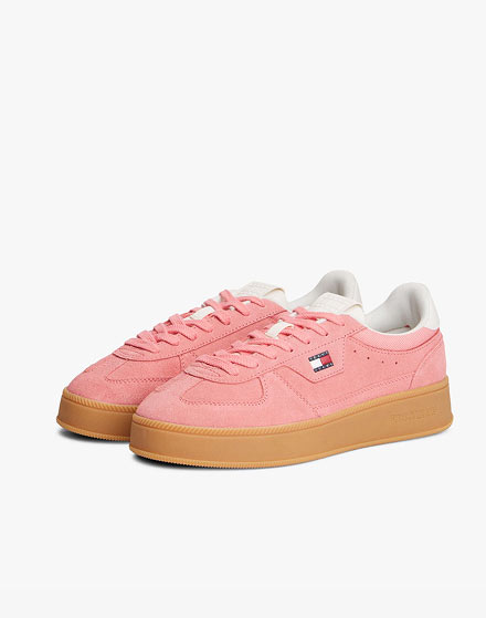 Pink Tommy Hilfiger sneakers on a white background.