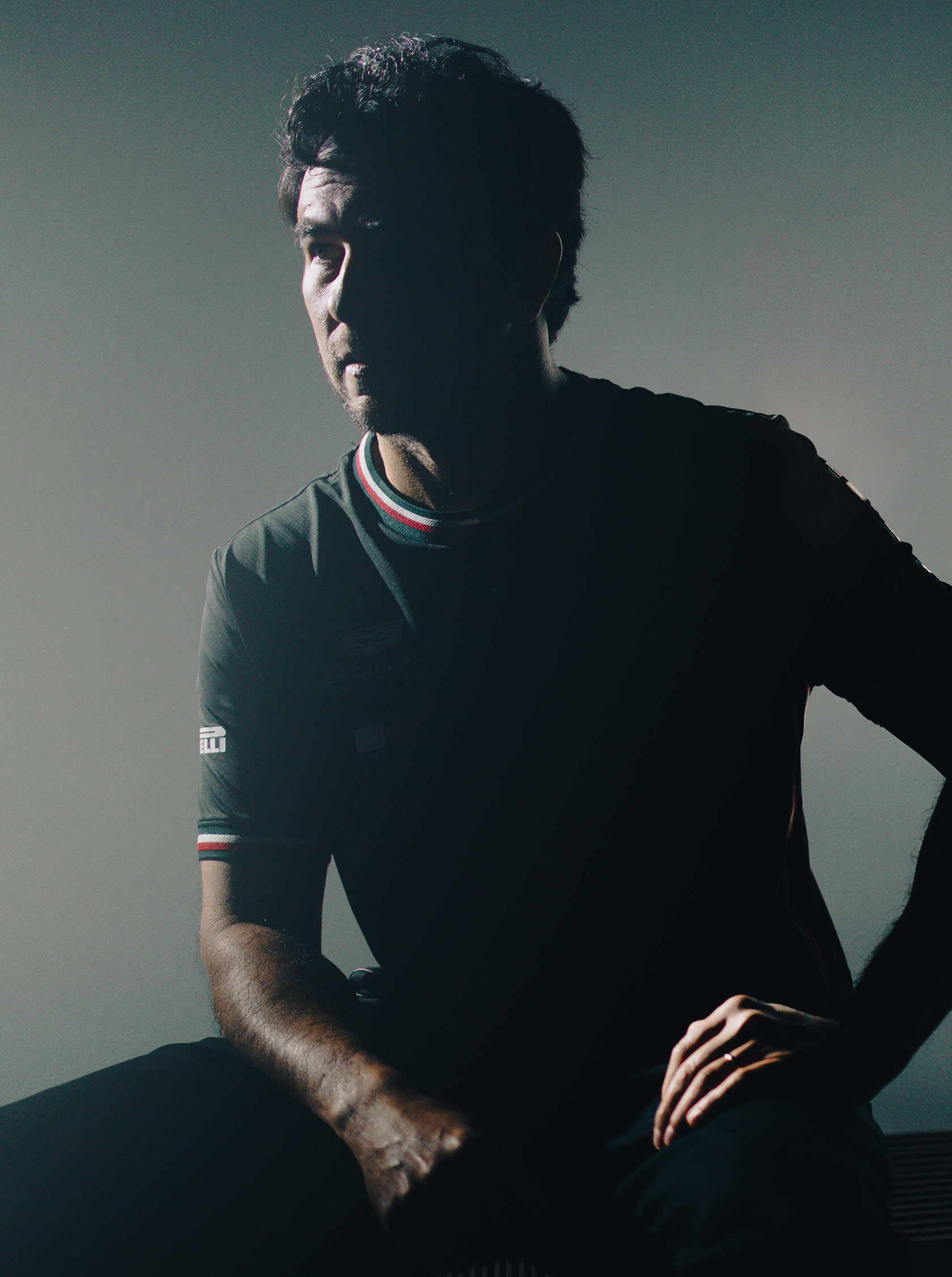 Checo Pérez wearing Tommy Hilfiger x Cadillac clothing.