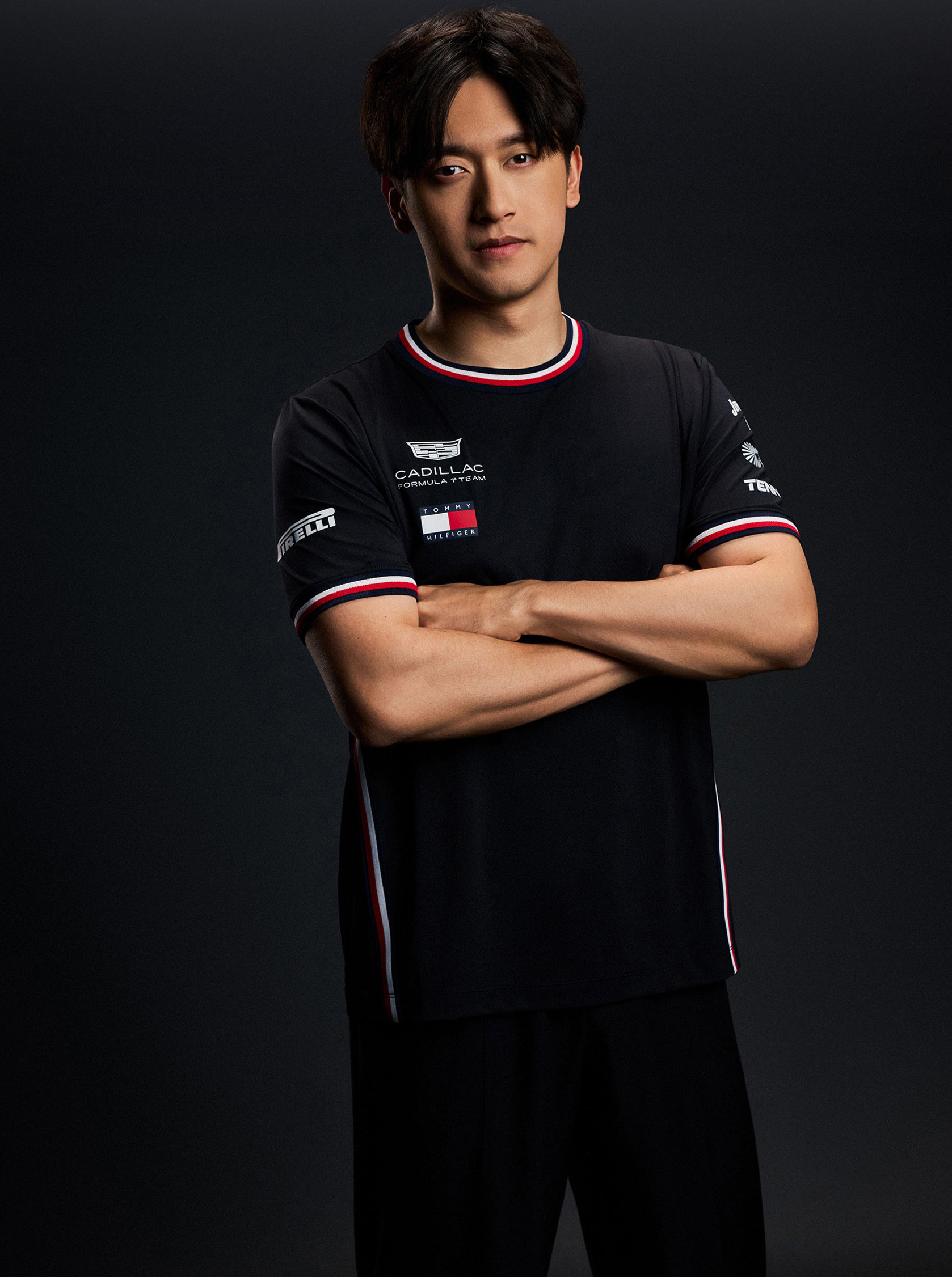 Zhou Guanyu wearing Tommy Hilfiger x Cadillac clothing.