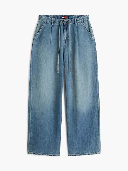 Light wash Tommy Hilfiger jeans on a white background.