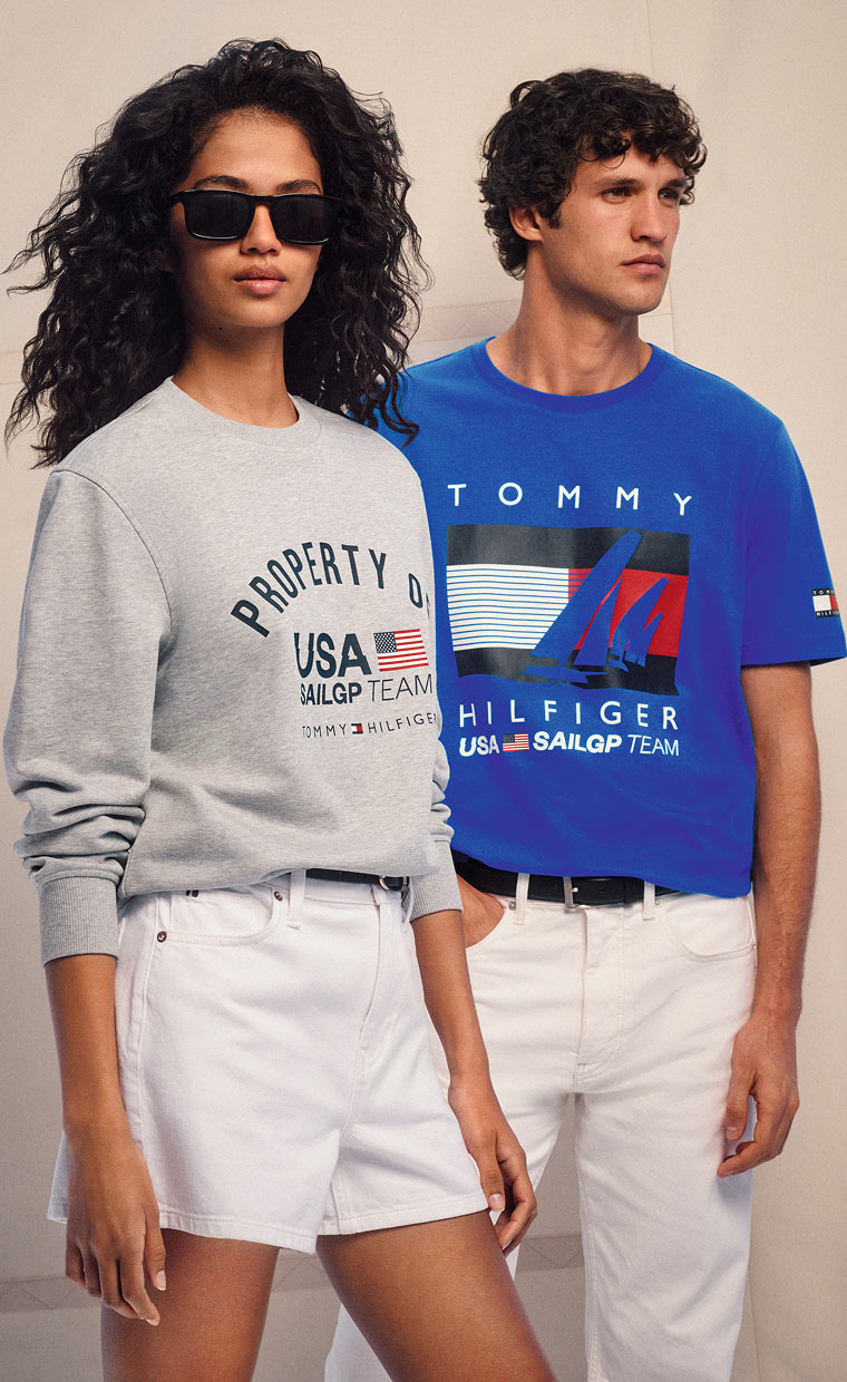 A male and female model wearing the Tommy x Sail GP capsule