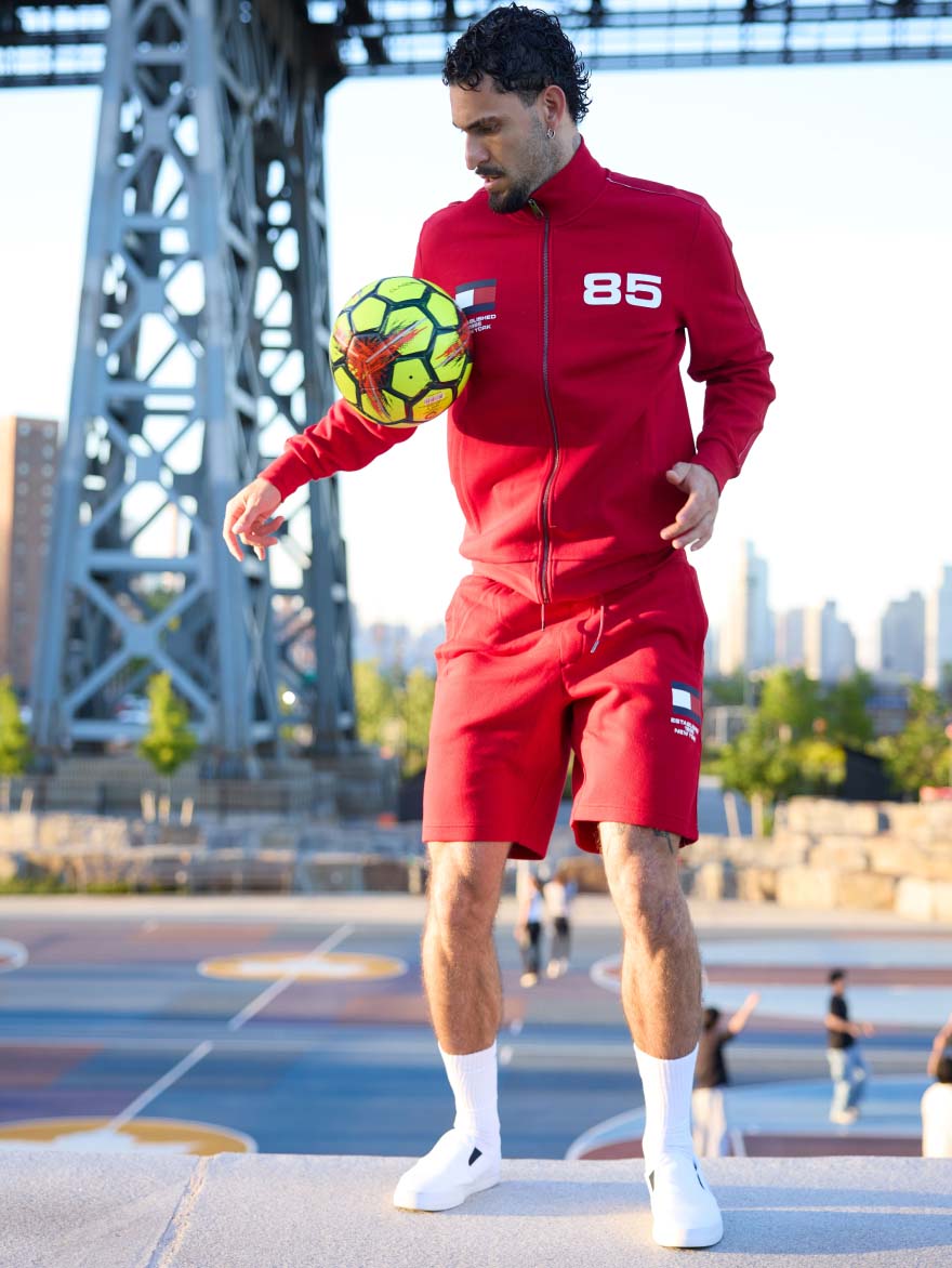 Influencer playing soccer outdoor wearing Hilfiger Team capsule