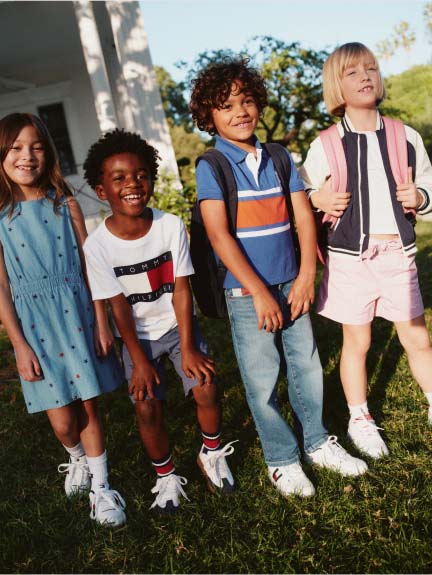 A group of kids wearing Tommy Hilfiger outifits