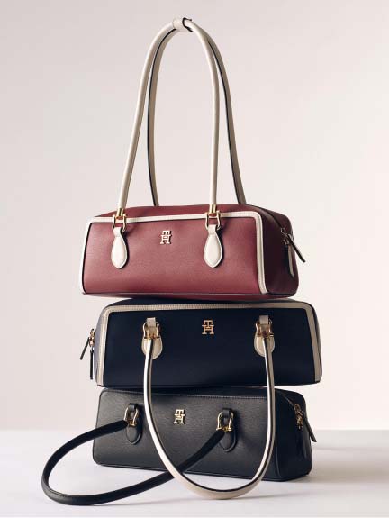 A stack of women's Tommy Hilfiger handbags