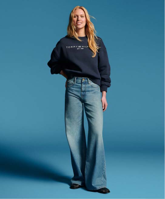 Female model wearing Tommy Hilfiger denim.