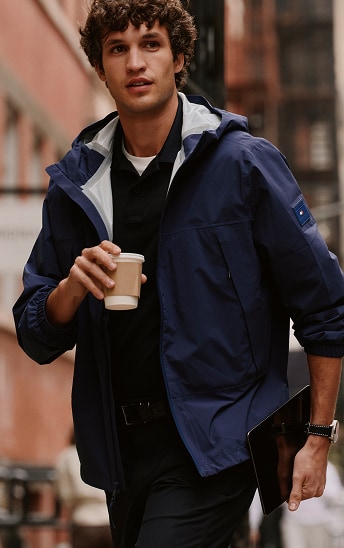 Man wearing a Tommy Hilfiger navy performance jackets.