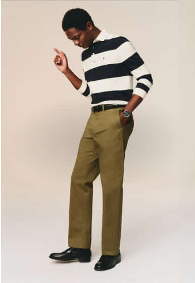 Three pairs of Tommy Hilfiger leather sneakers in tan, navy, and black displayed side by side on a neutral background.