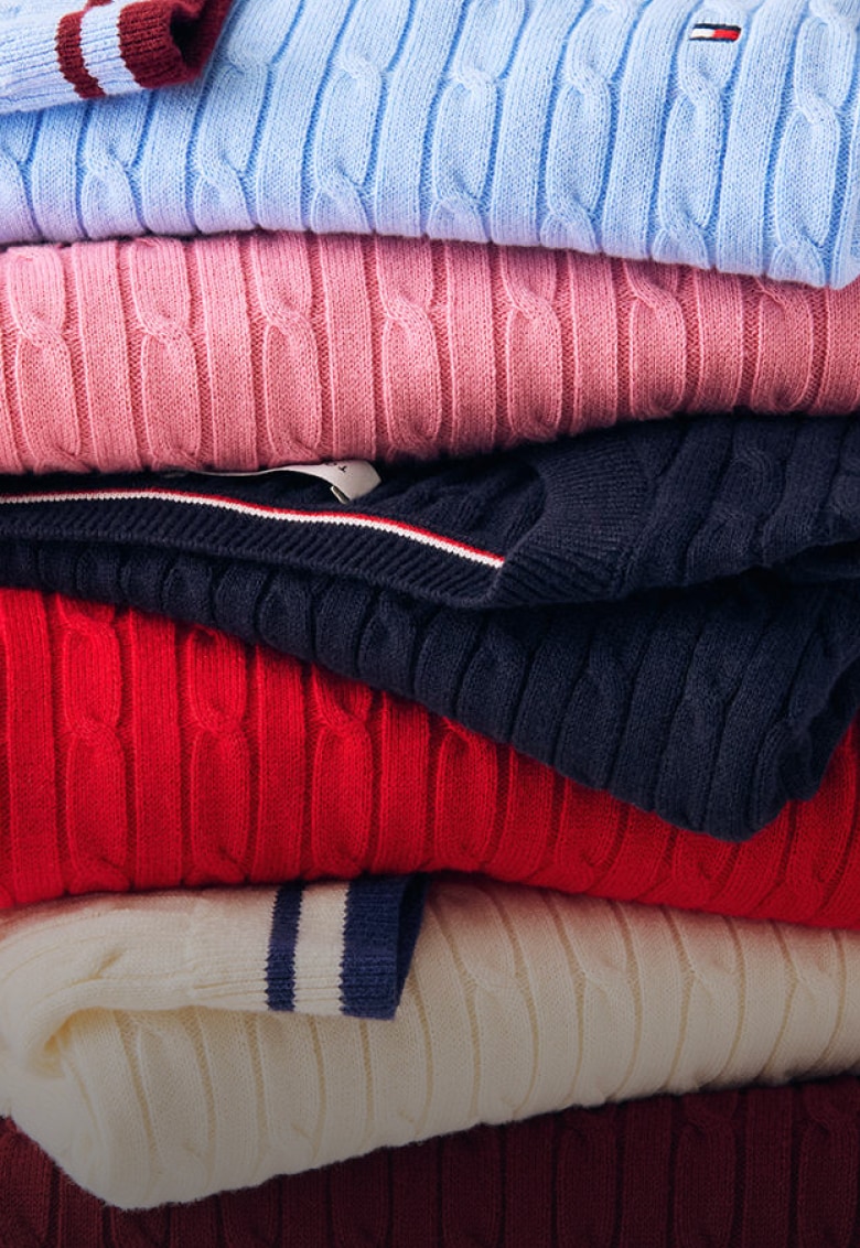 A stack of Tommy Hilfiger Cable Knit sweaters.