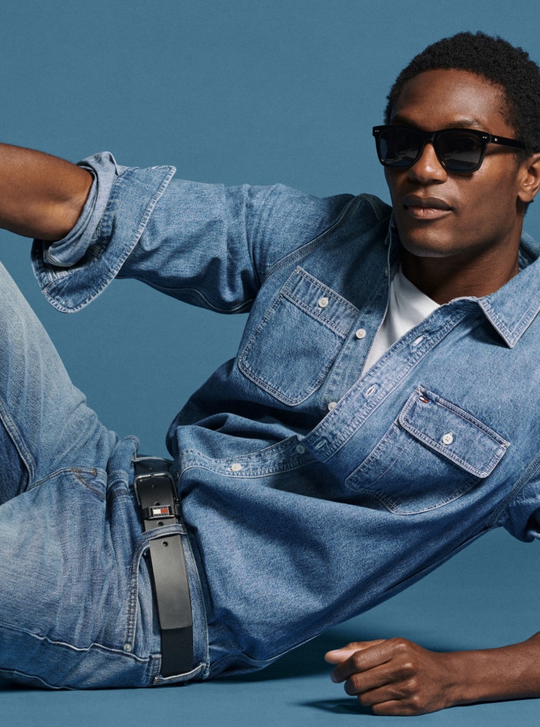 Model in denim wearing Tommy Hilfiger.