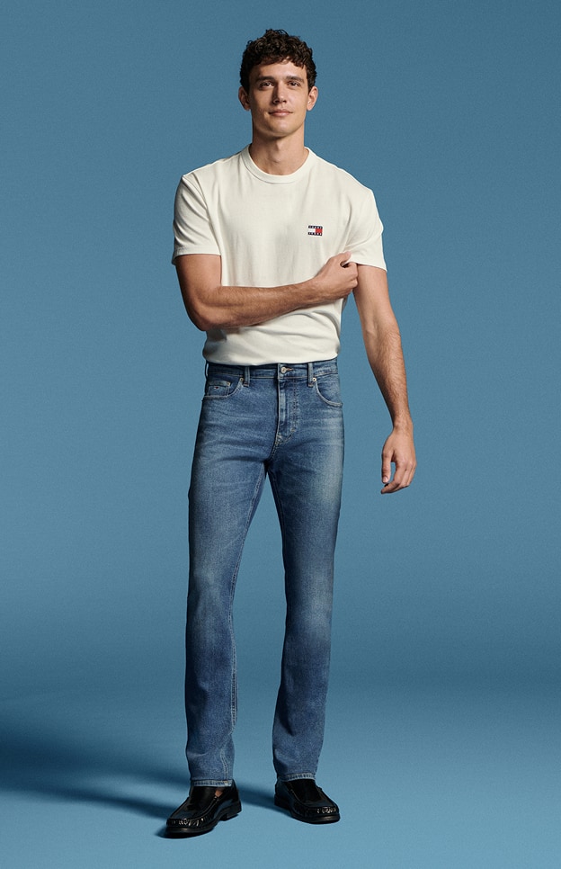 Model in denim wearing Tommy Hilfiger.