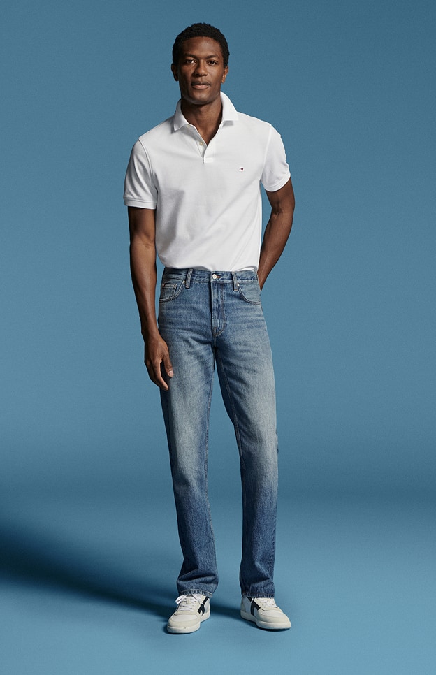 Model in denim wearing Tommy Hilfiger.