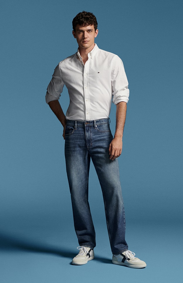 Model in denim wearing Tommy Hilfiger.