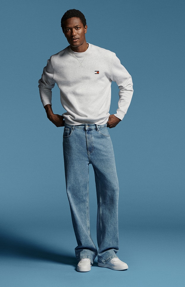 Model in denim wearing Tommy Hilfiger.