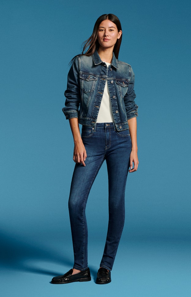 Model in denim wearing Tommy Hilfiger.