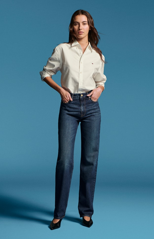 Model in denim wearing Tommy Hilfiger.