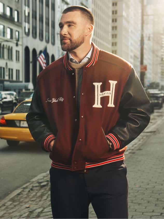 Travis Kelce wearing a Tommy Hilfiger outfit.