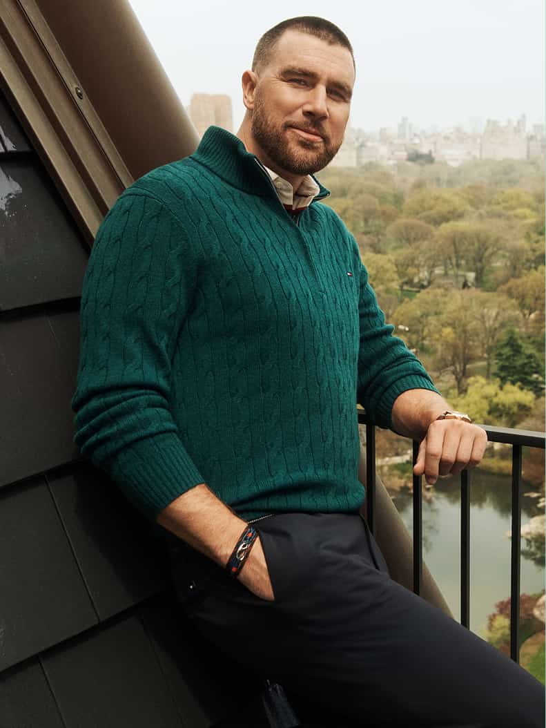 Travis Kelce wearing a Tommy Hilfiger outfit.