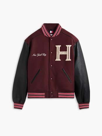 Tommy Hilfiger varsity jacket on a white background.