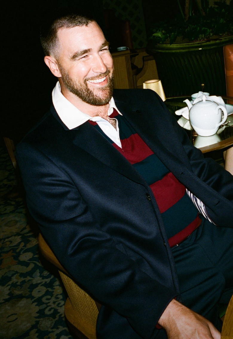 Travis Kelce wearing a Tommy Hilfiger outfit.