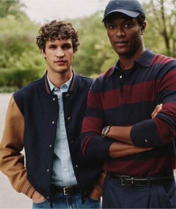 Two models wearing Tommy Hilfiger outfits.