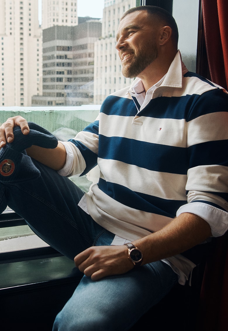 Travis Kelce wear a blue and white striped rugby shirt, new from Tommy Hilfiger.