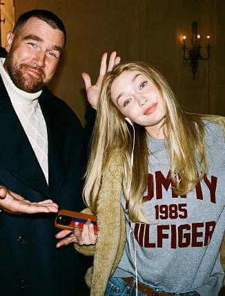 Travis Kelce and Gigi Hadid wearing Tommy Hilfiger in the Plaza Hotel.