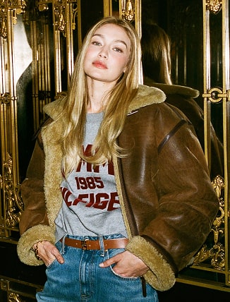 Gigi Hadid wearing a Tommy Hilfiger jacket in the Plaza Hotel.