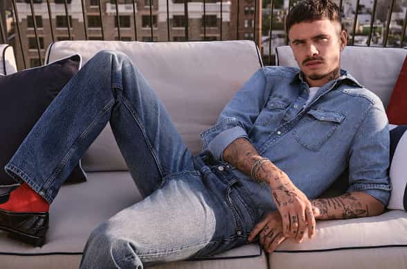 Romeo wearing Tommy Hilfiger denim.