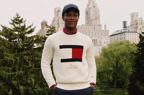 Model wearing Tommy Hilfiger Logo sweater.